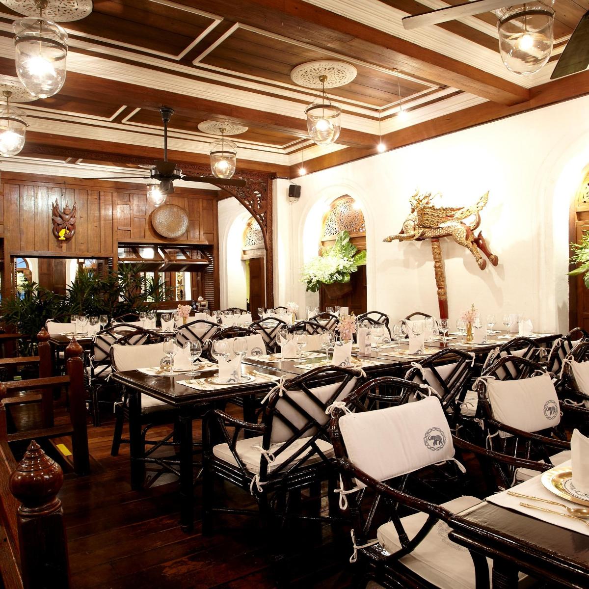 a dining room with long tables and chairs