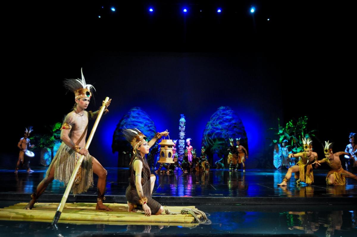 a group of performers on a stage in a show