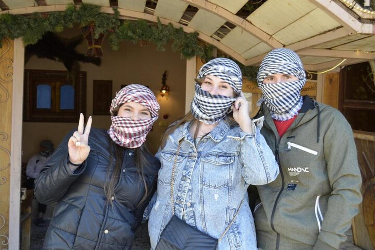 a group of three people with their faces covered