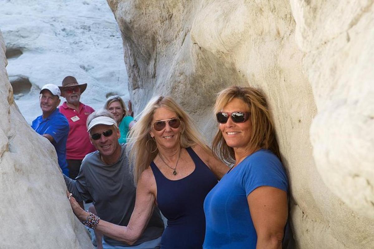 a group of people standing in a rock formation