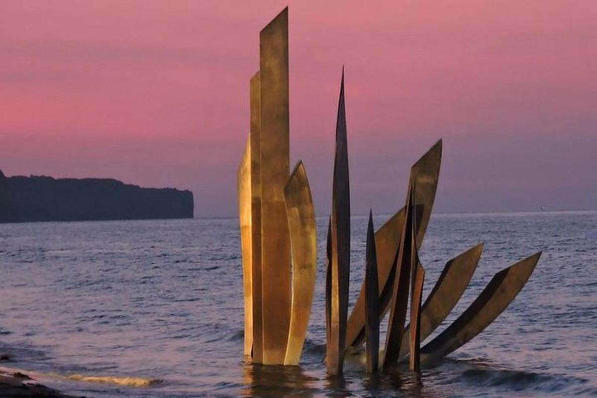 a sculpture in the water in the ocean