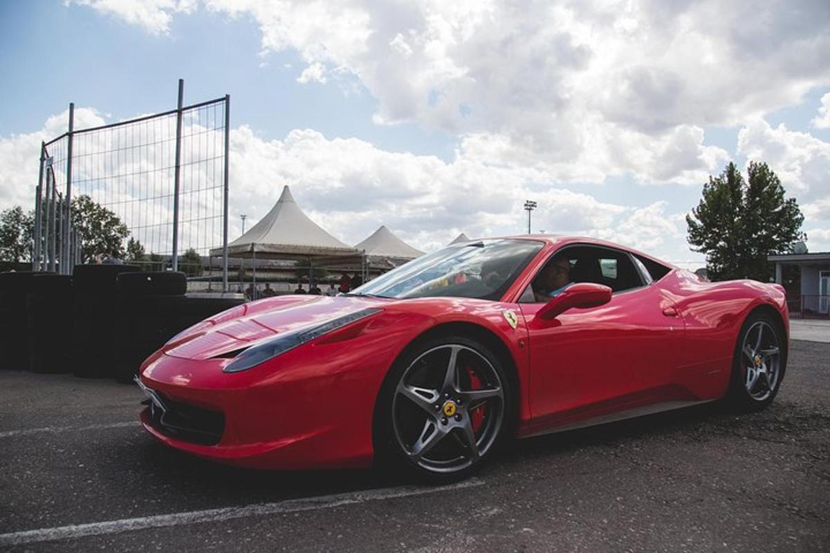 a red sports car parked in a parking lot