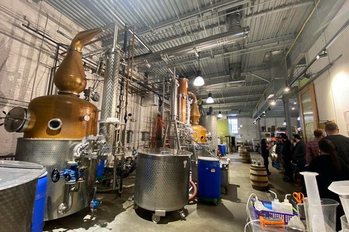 a room with a brewery with people standing around