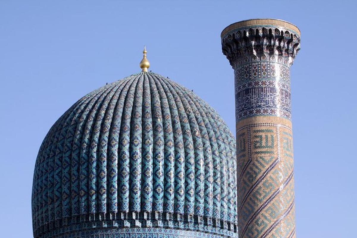 a minaret of a mosque with a dome and a tower