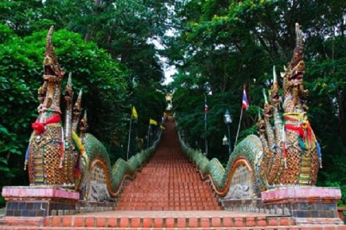 a stairway in a park with flags on it