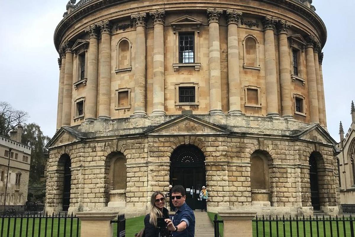 a man and a woman standing in front of a building