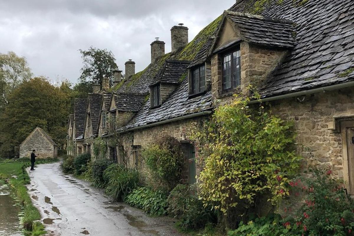 a person walking down a street in an old house