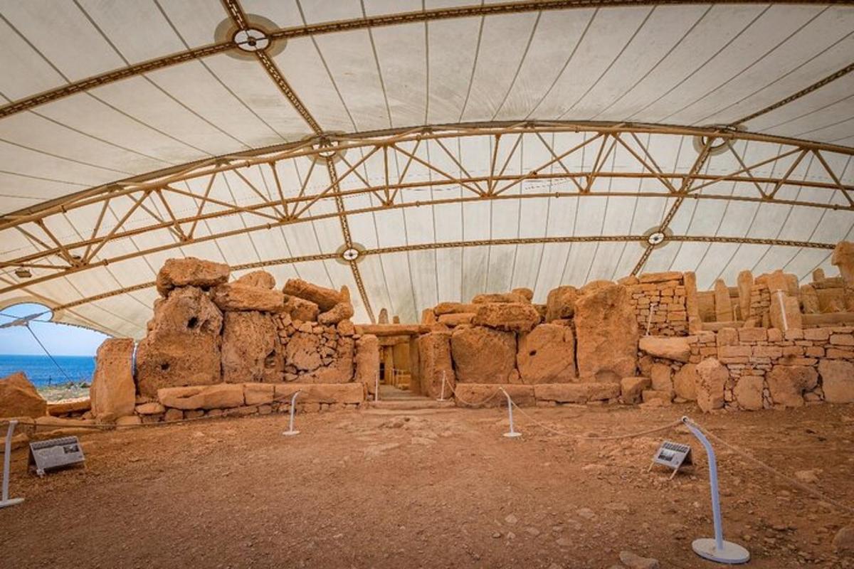 a large building with a roof with ruins