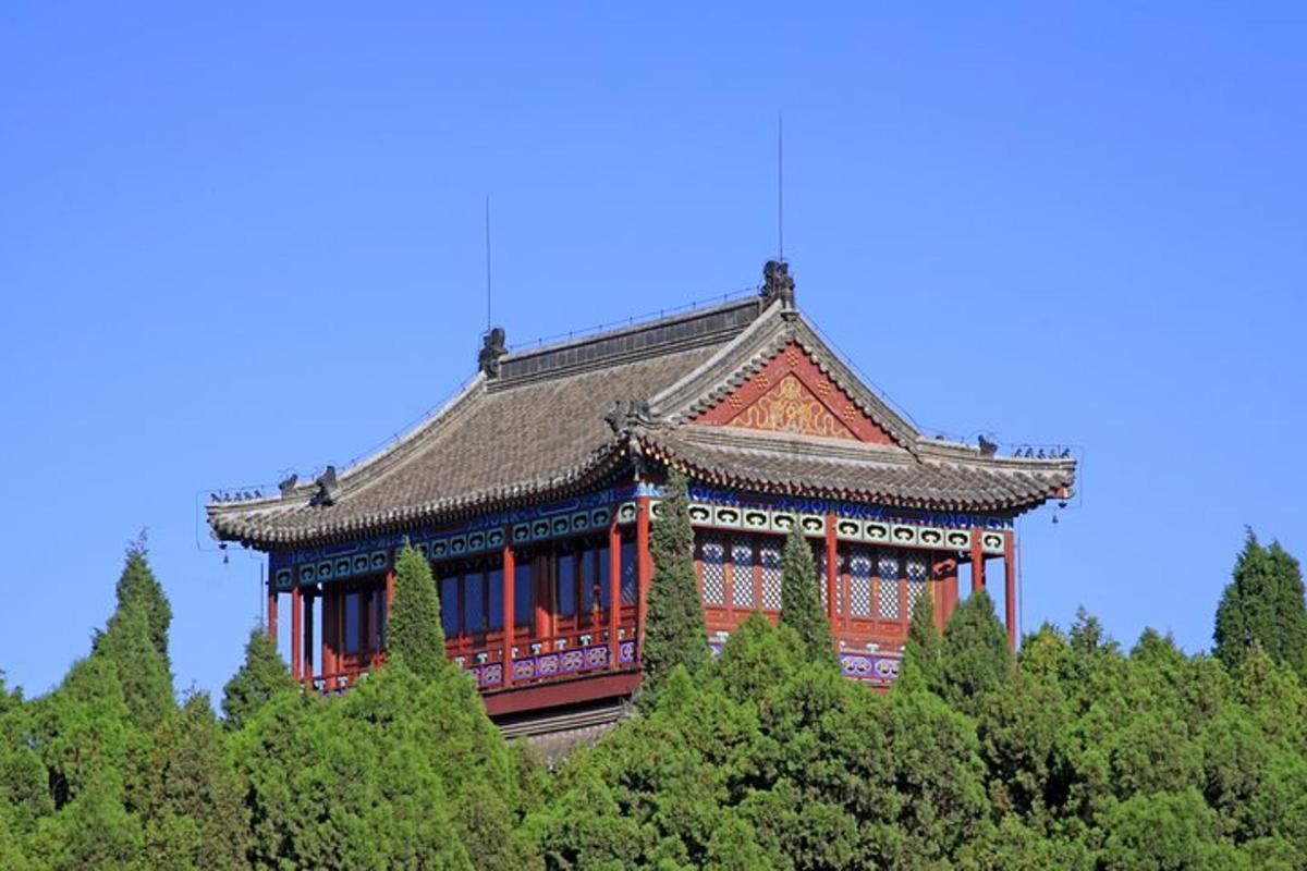an asian building with a roof on top of trees