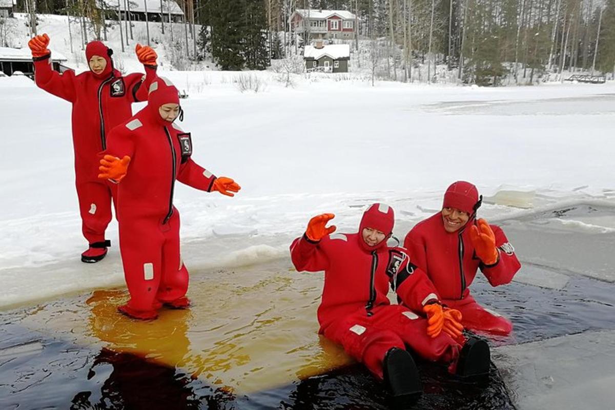 a group of people dressed in red in the snow