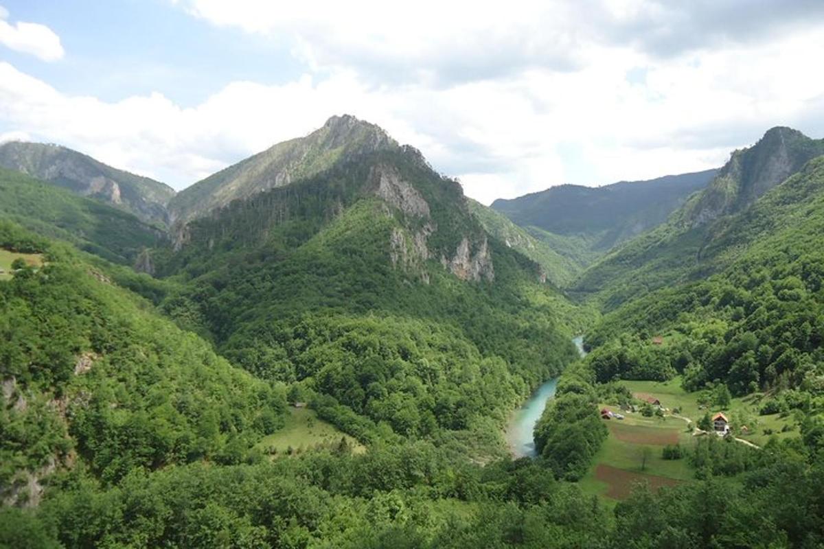 a view of a mountain valley with a river