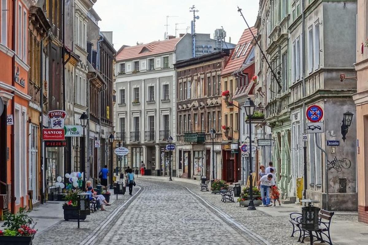 a cobblestone street in a city with buildings