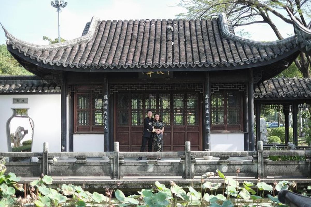 two people standing in front of a building