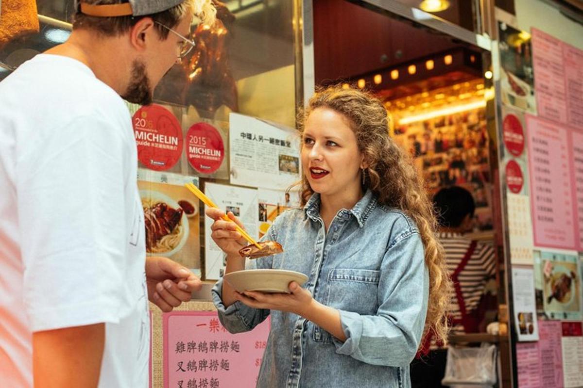 a woman holding a plate of food in a store
