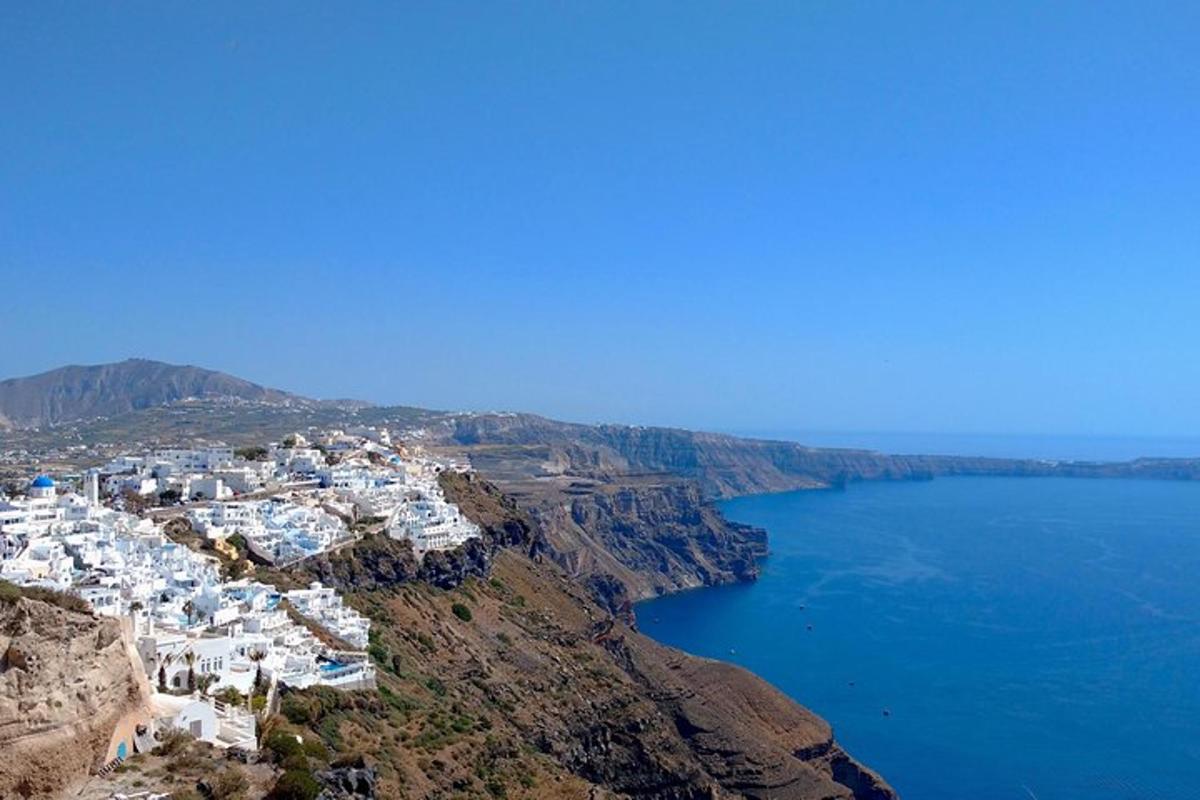 a group of white buildings on the side of a mountain