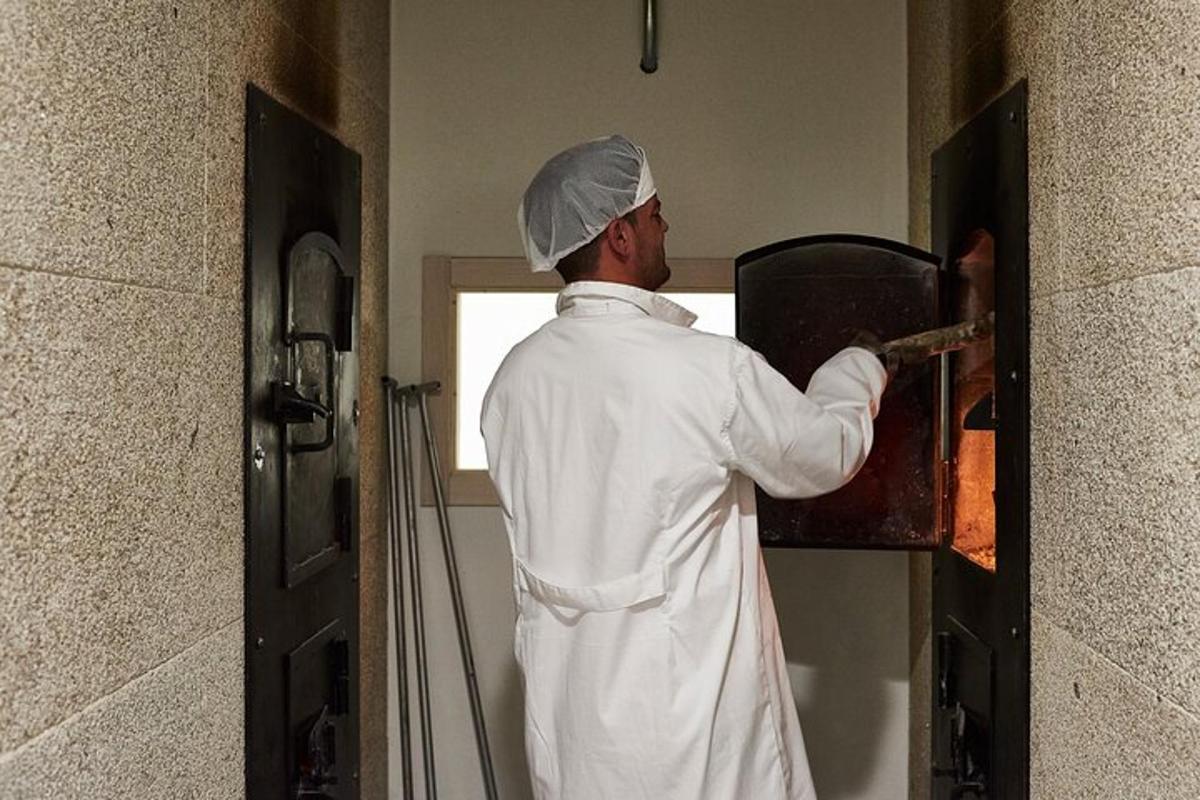 a chef is standing in a kitchen preparing food