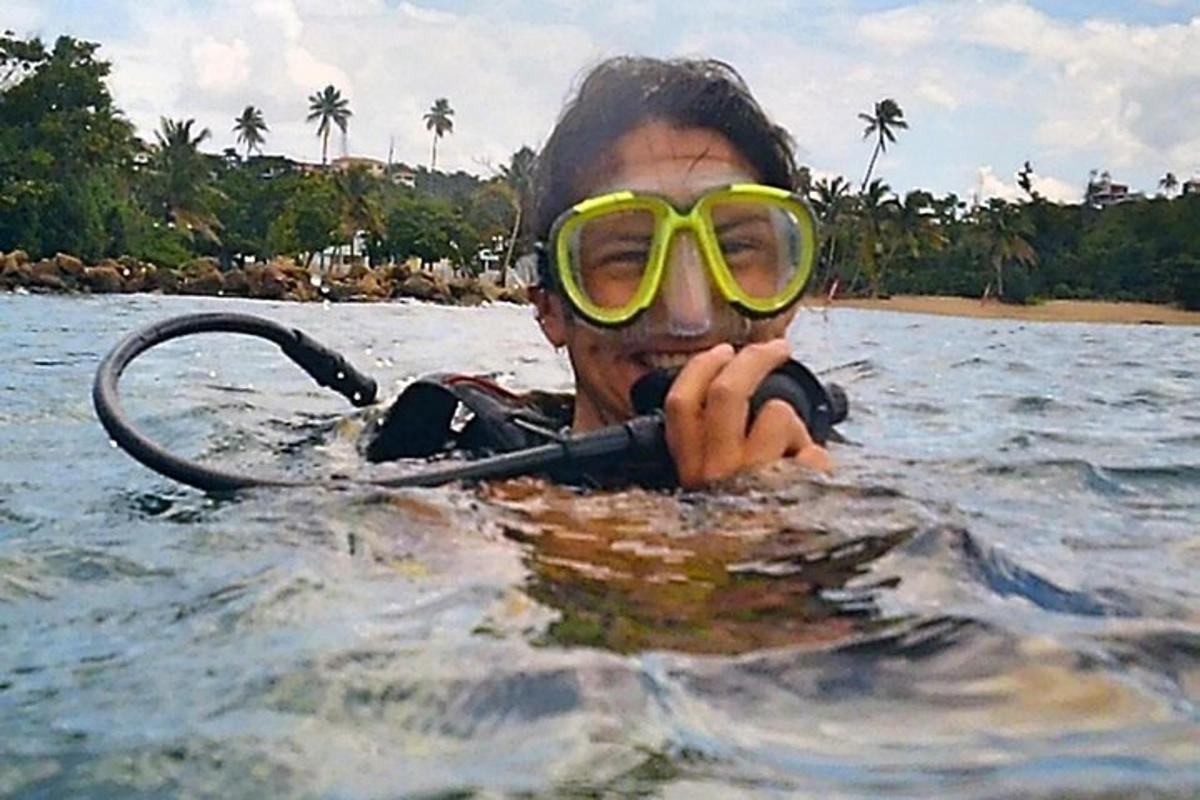 a man wearing goggles in a body of water