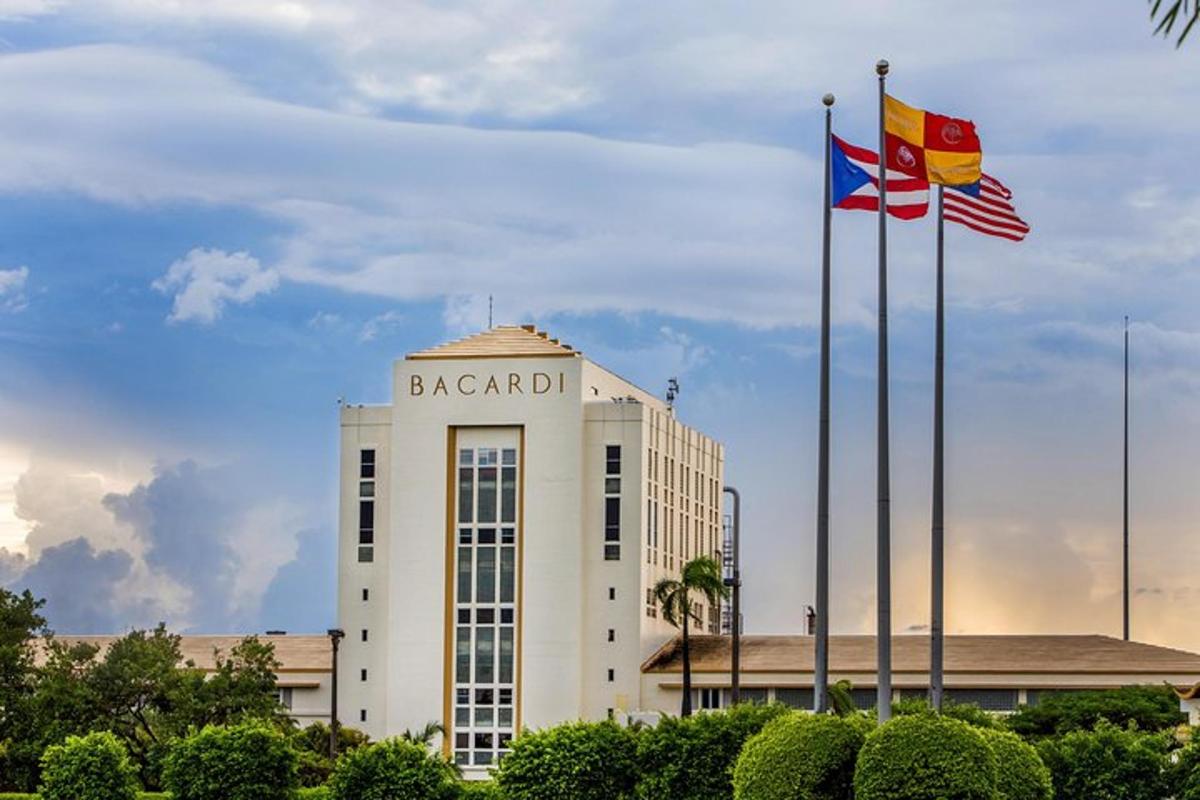 two flags are flying in front of a building