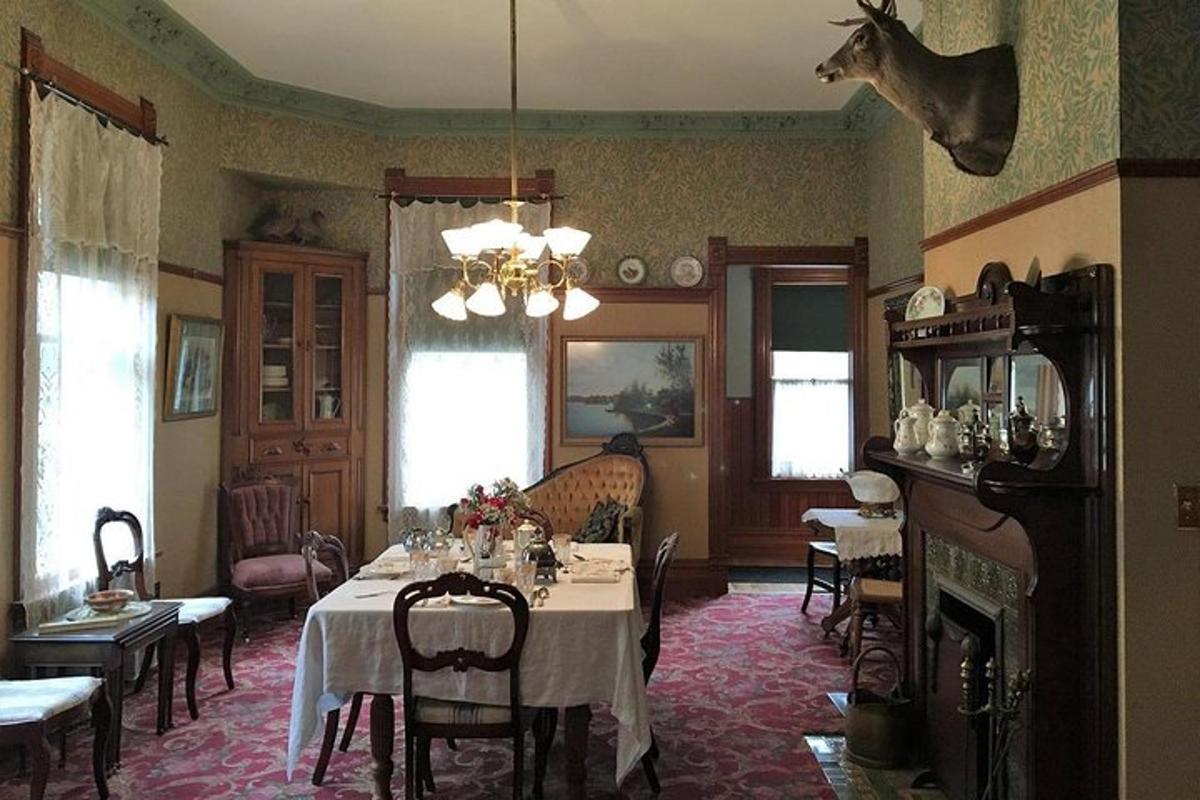 a dining room with a table and a fireplace