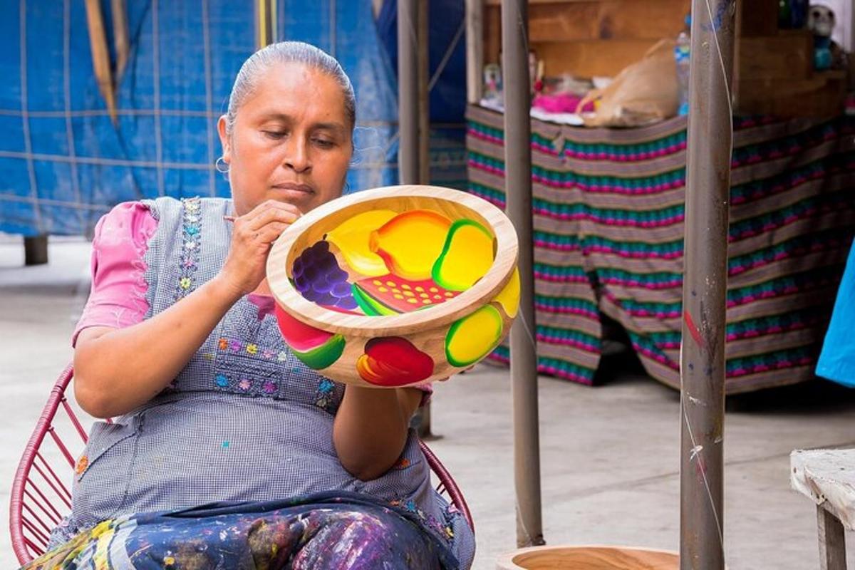 a woman sitting in a chair holding a frisbee