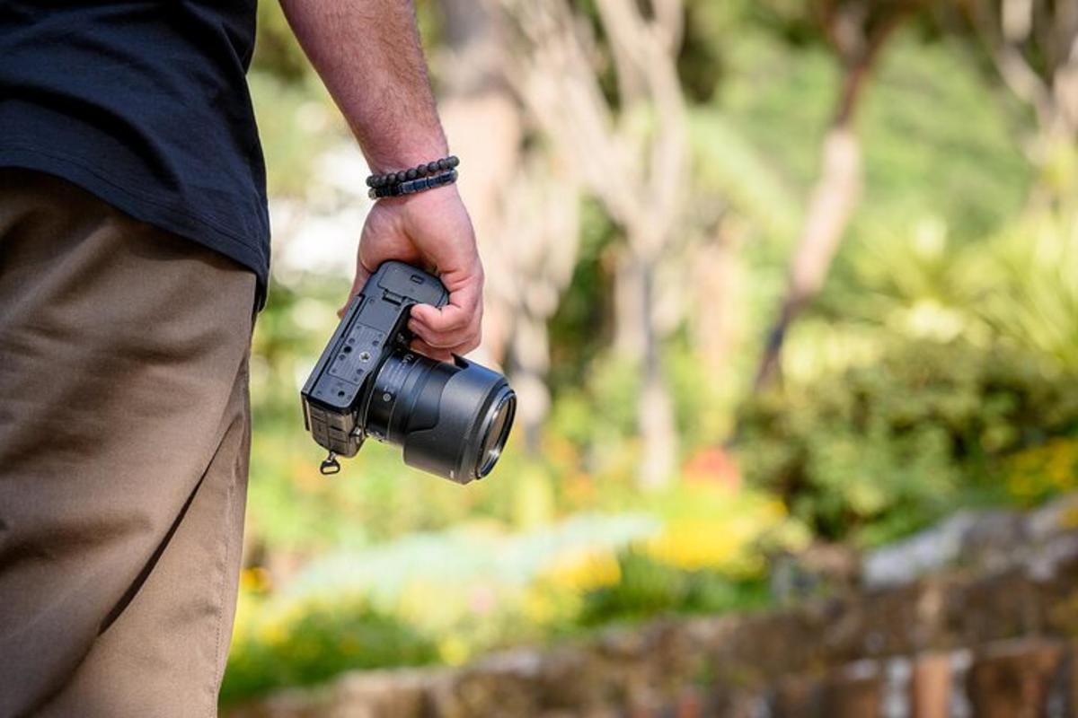 a man holding a camera in his hand