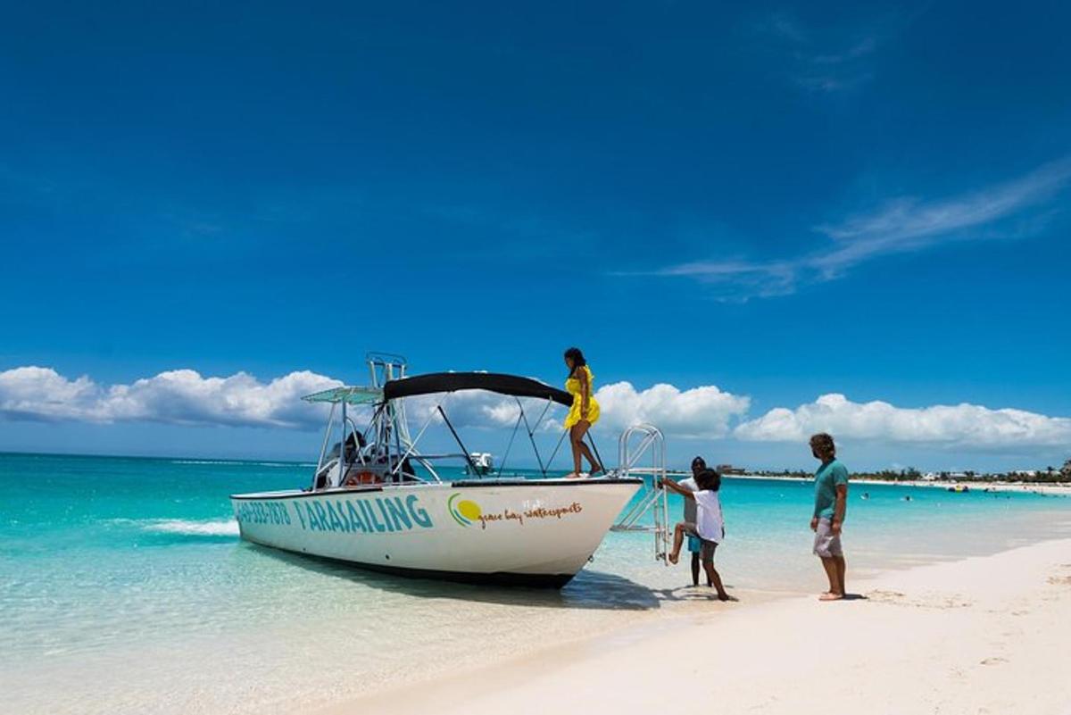 a group of people standing on a boat on a beach