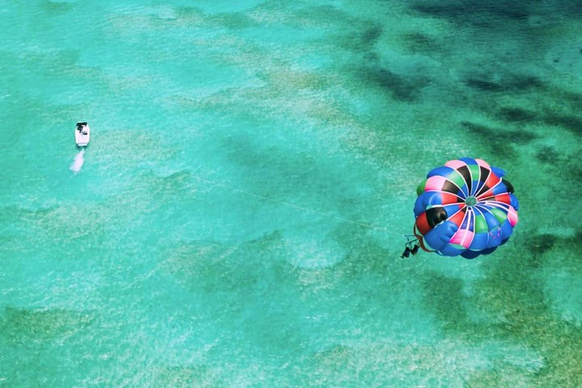 a person in the water with a beach ball