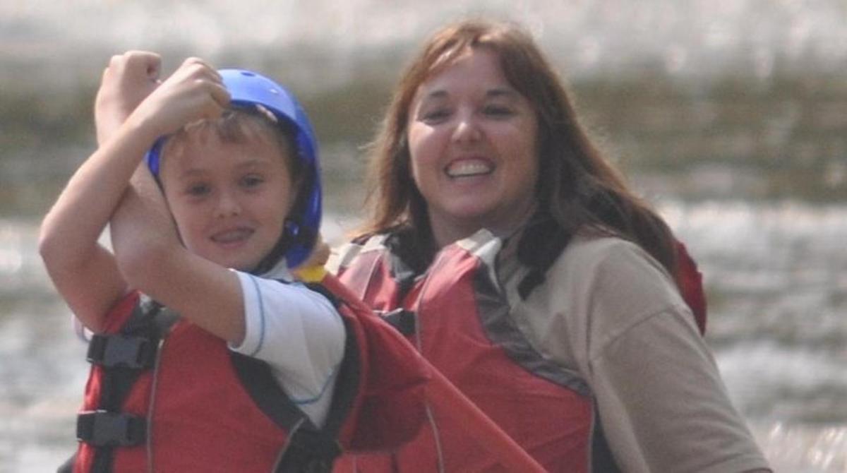 a woman and a child wearing a life vest