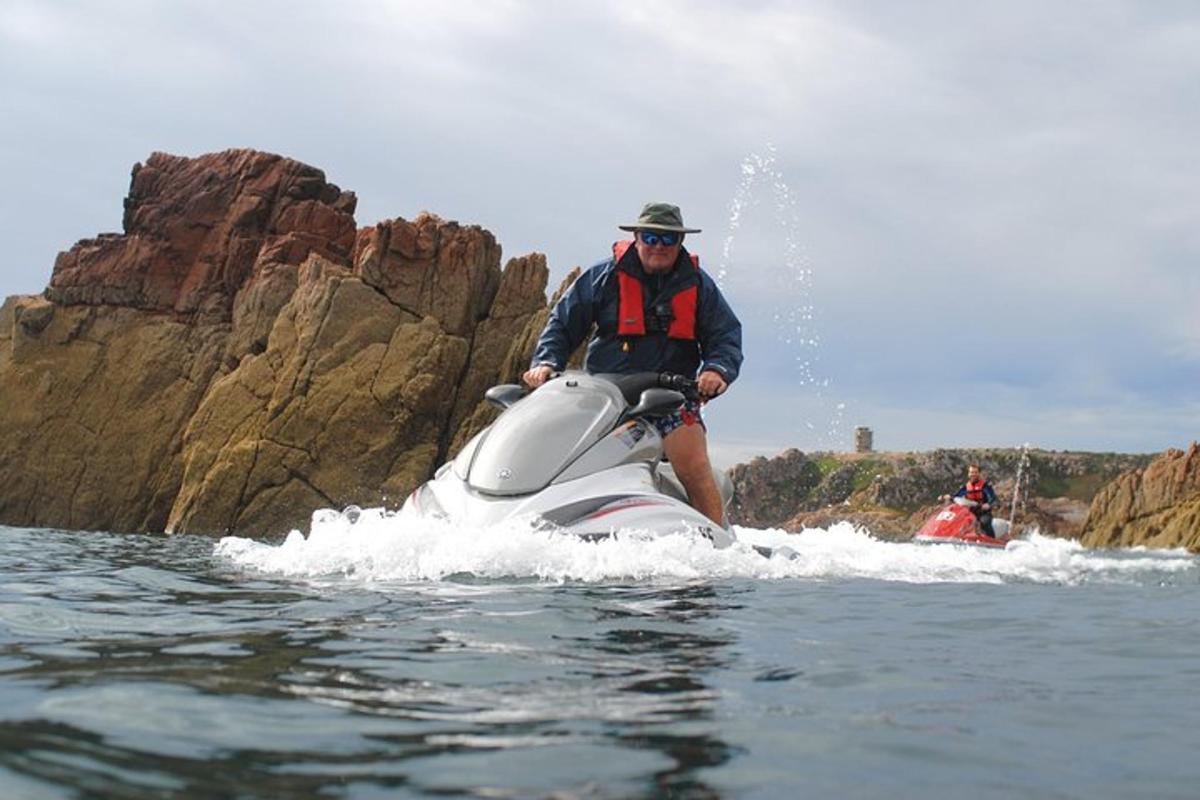 a man riding on a jet ski in the water