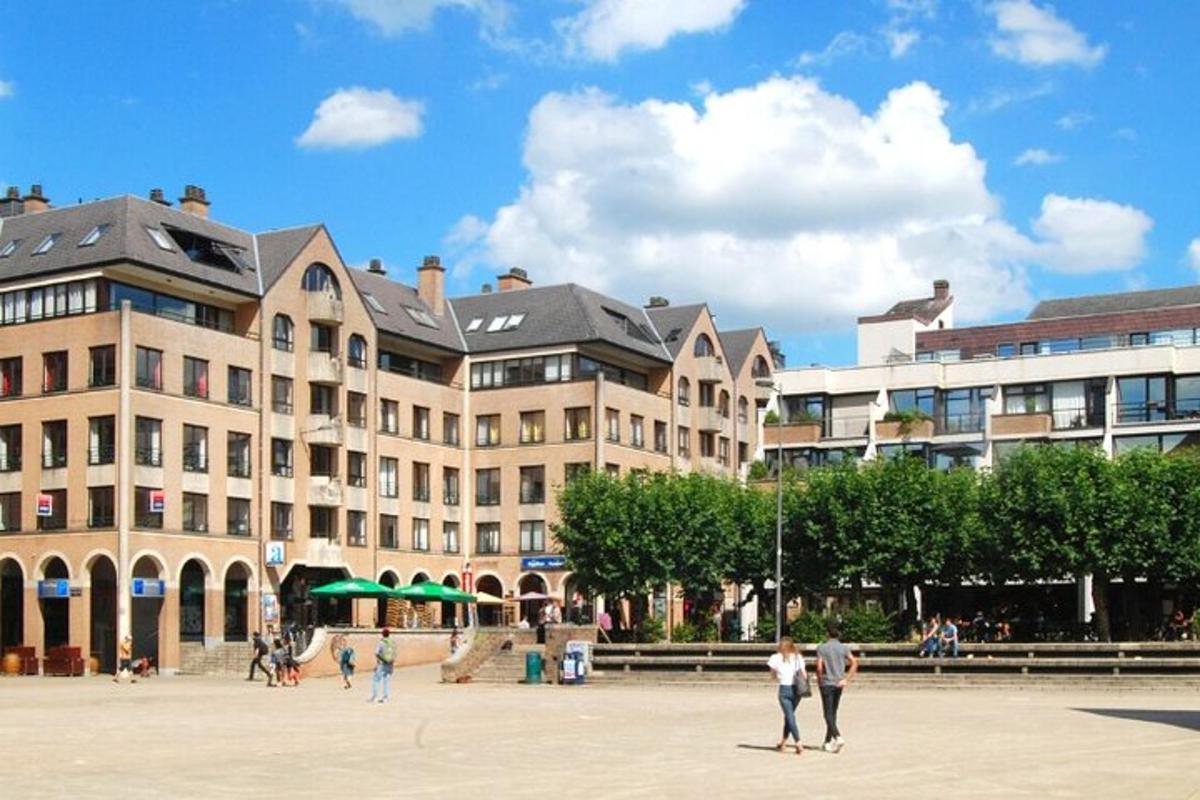 a large building with people walking in front of it