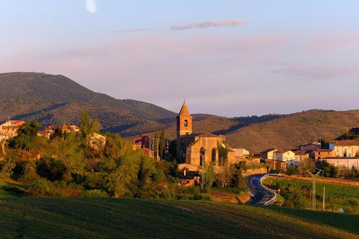 a small town with a church and a road
