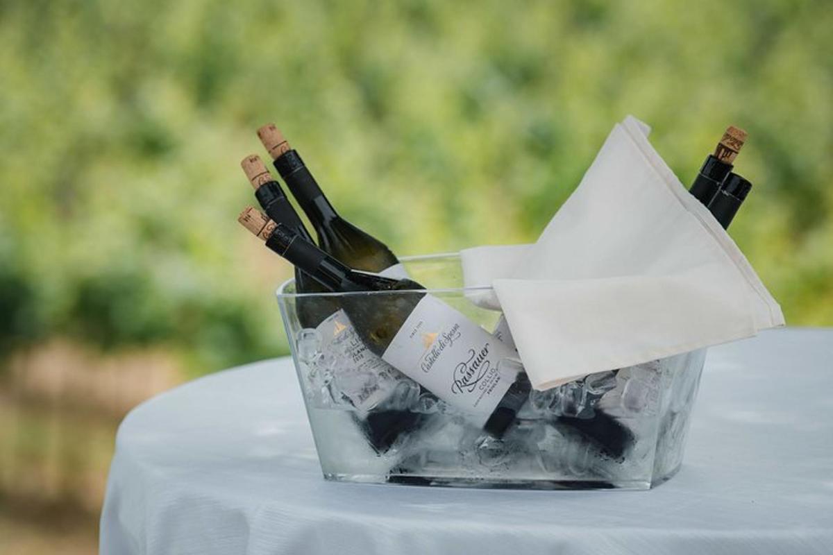 a glass container of wine bottles on a table
