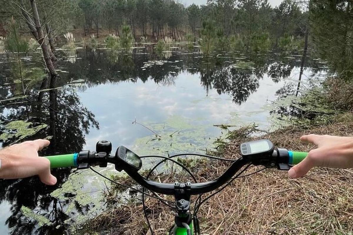 a person riding a bike near a body of water
