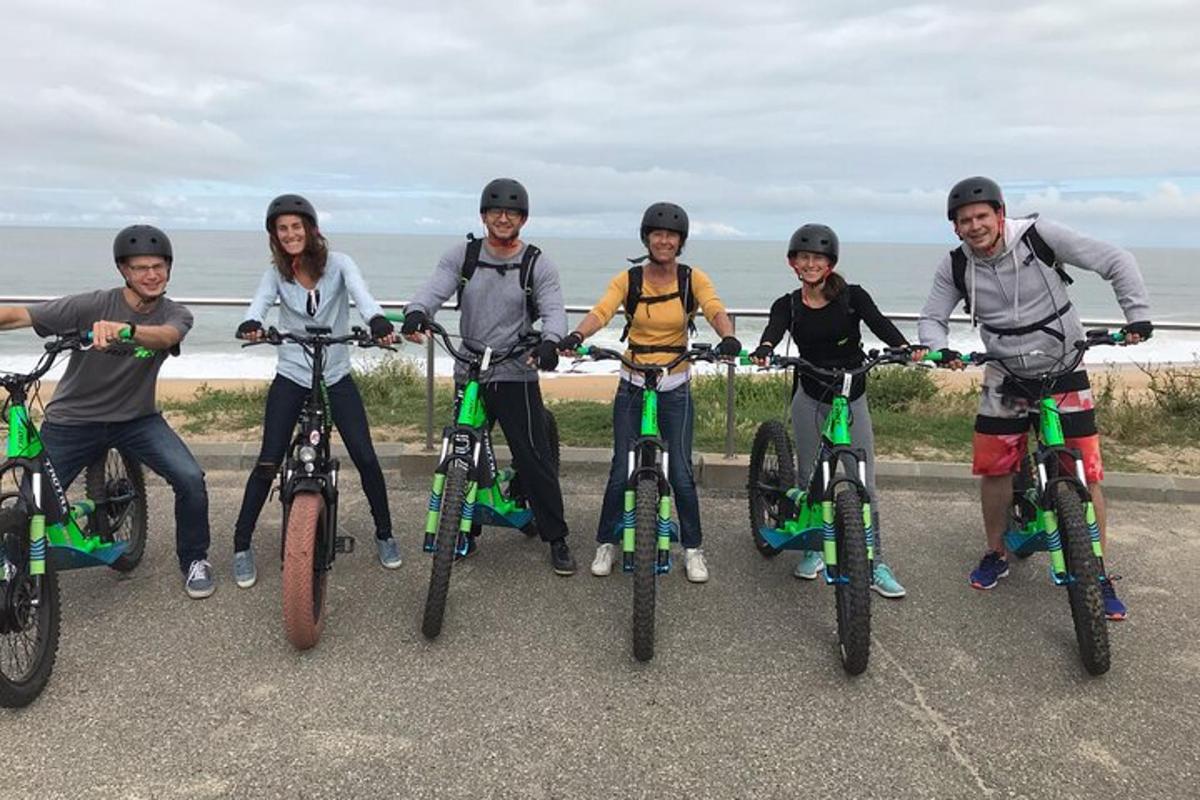 a group of people standing on their bikes