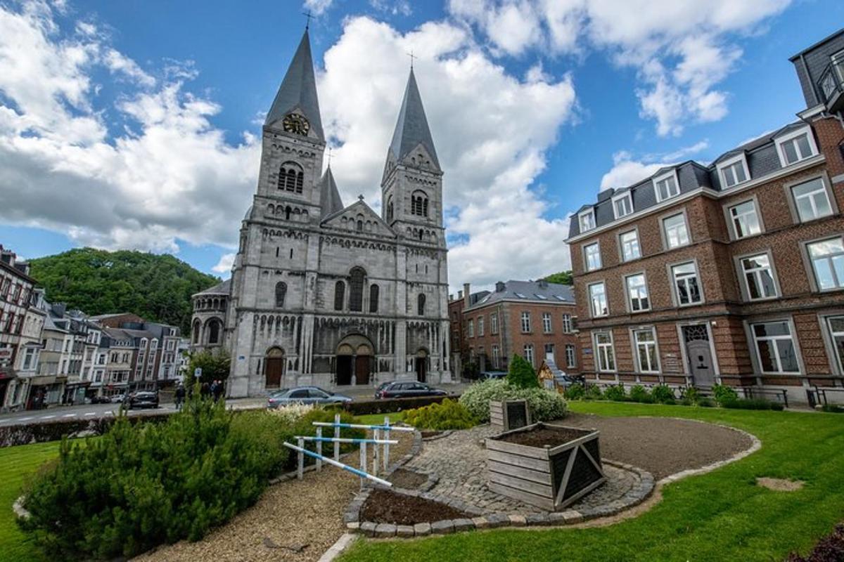 an old church with a tower in a city