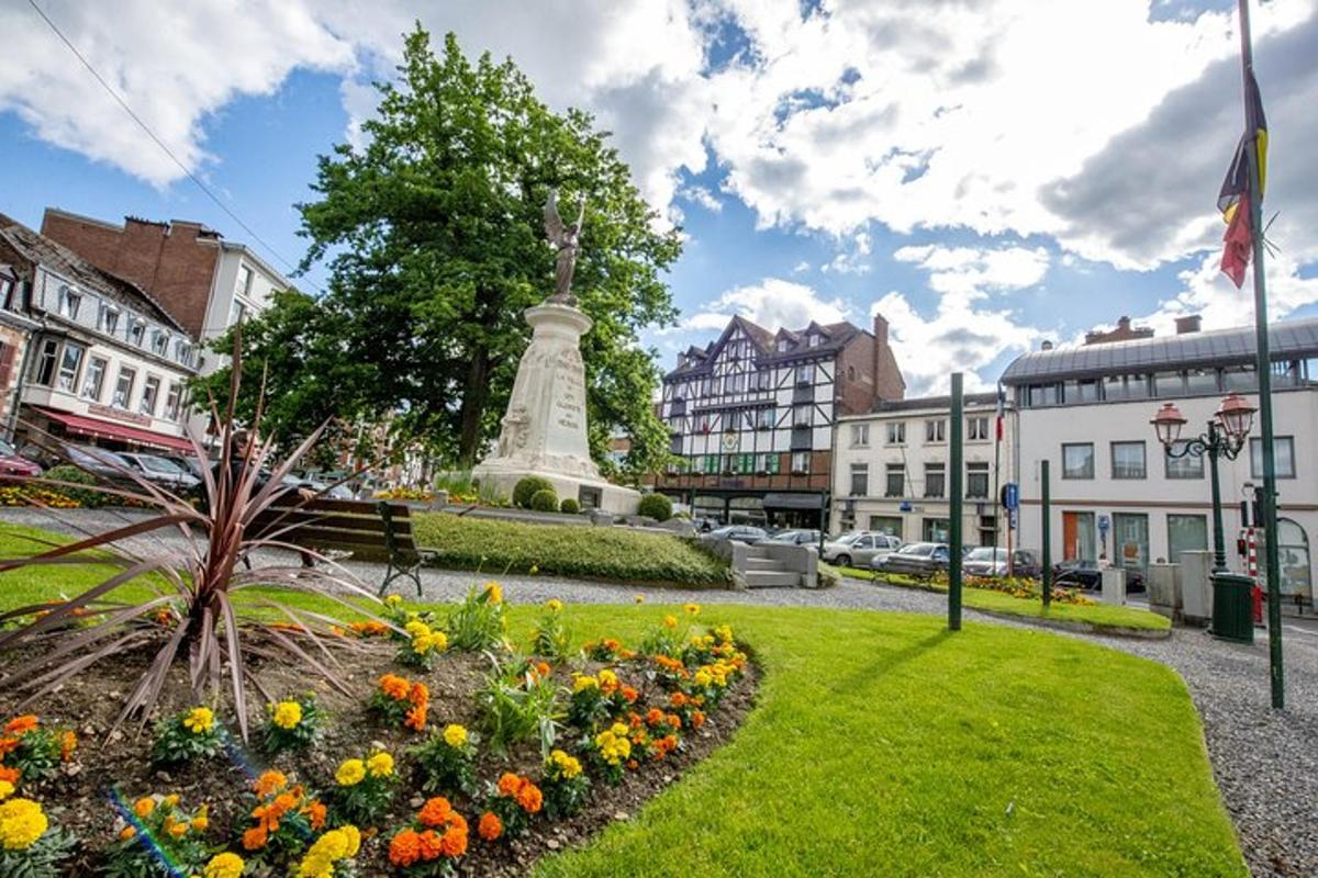 a park with a monument in the middle of a city