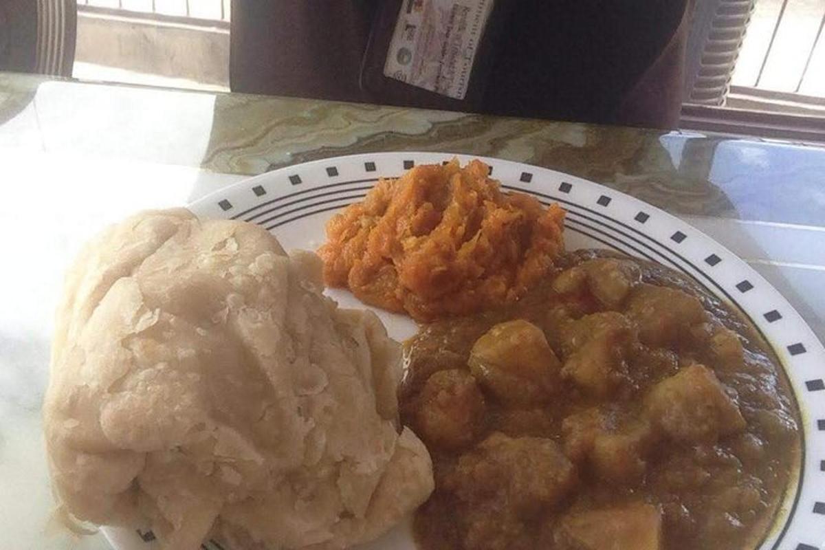 a plate of food with meat and biscuits on a table