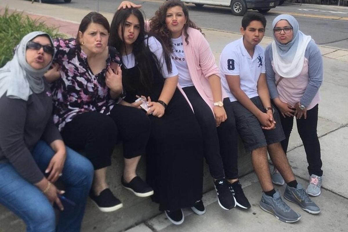 a group of people are posing for a picture