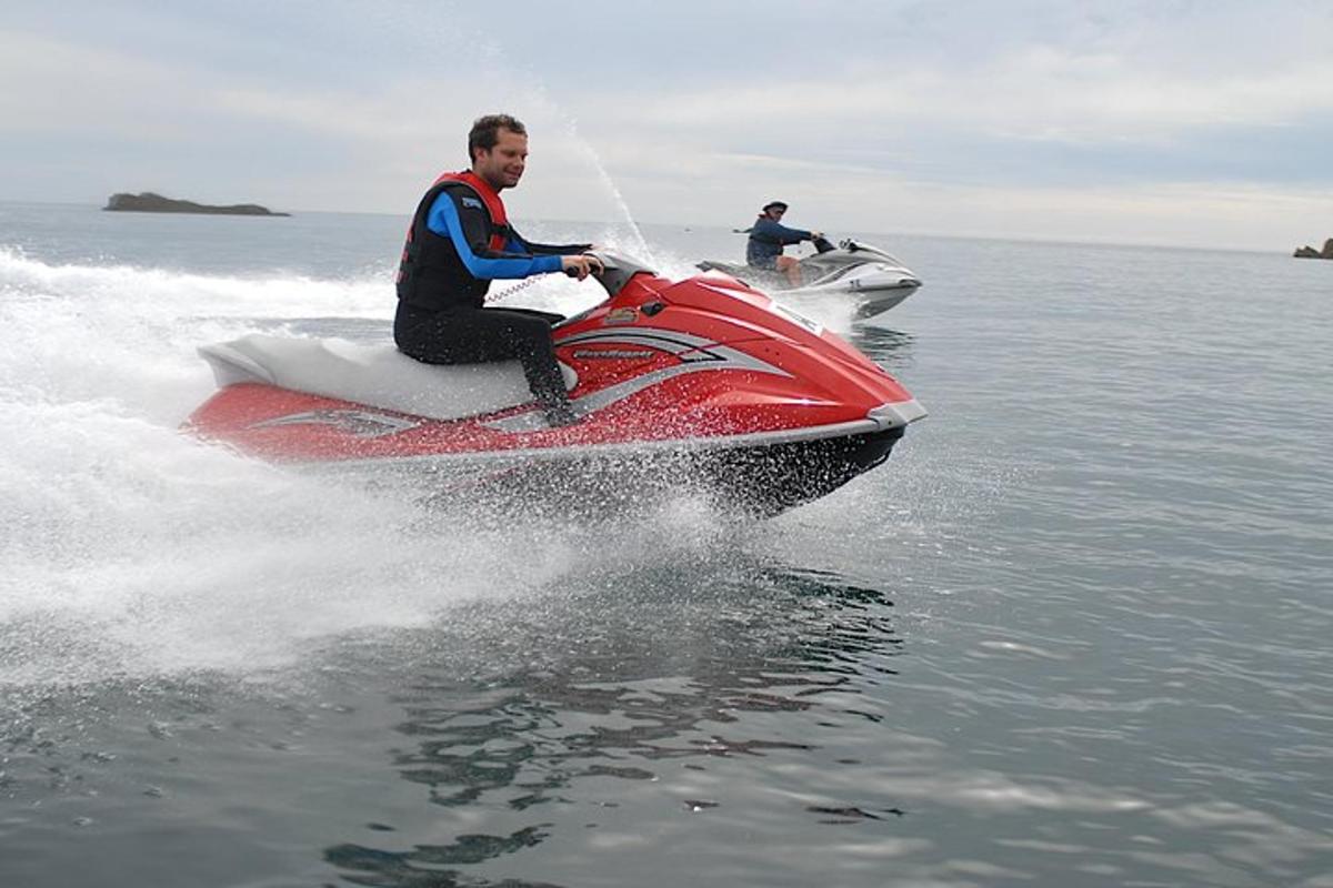 two people on a jet ski in the water
