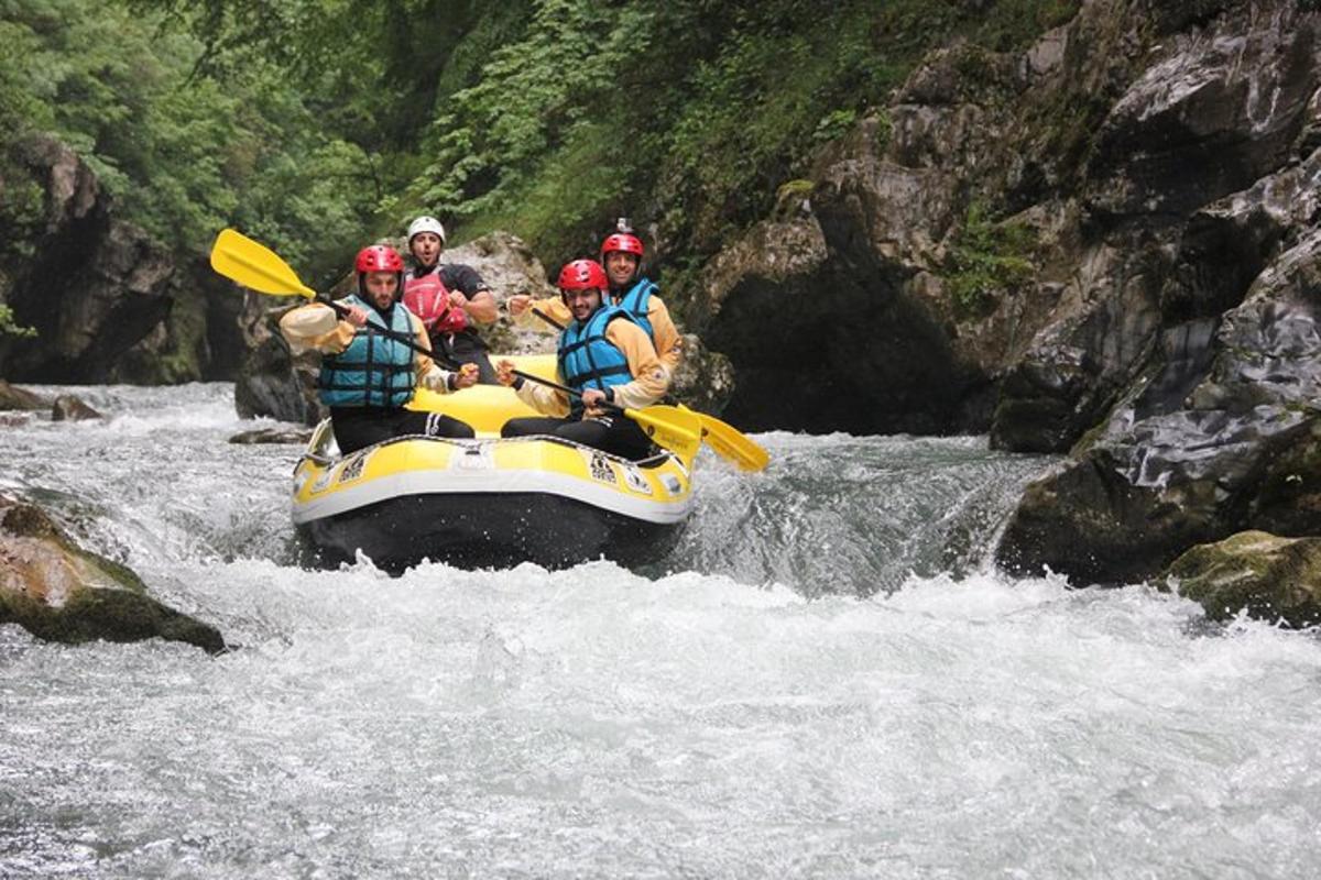 a group of people on a raft in a river