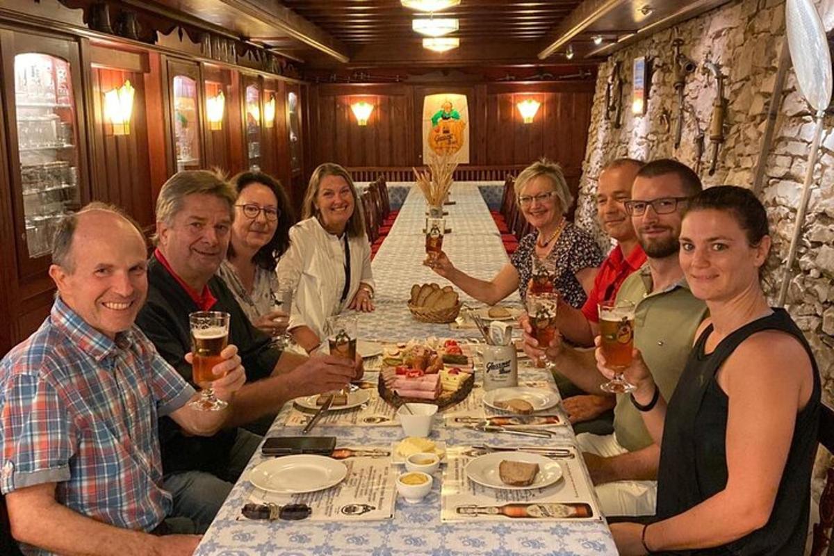 a group of people sitting around a table with drinks