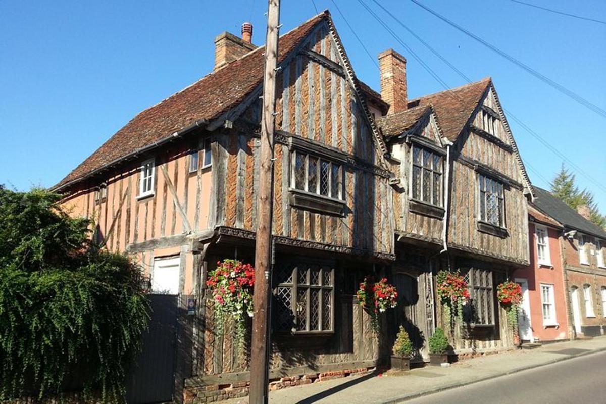 an old building with flowers on the front of it