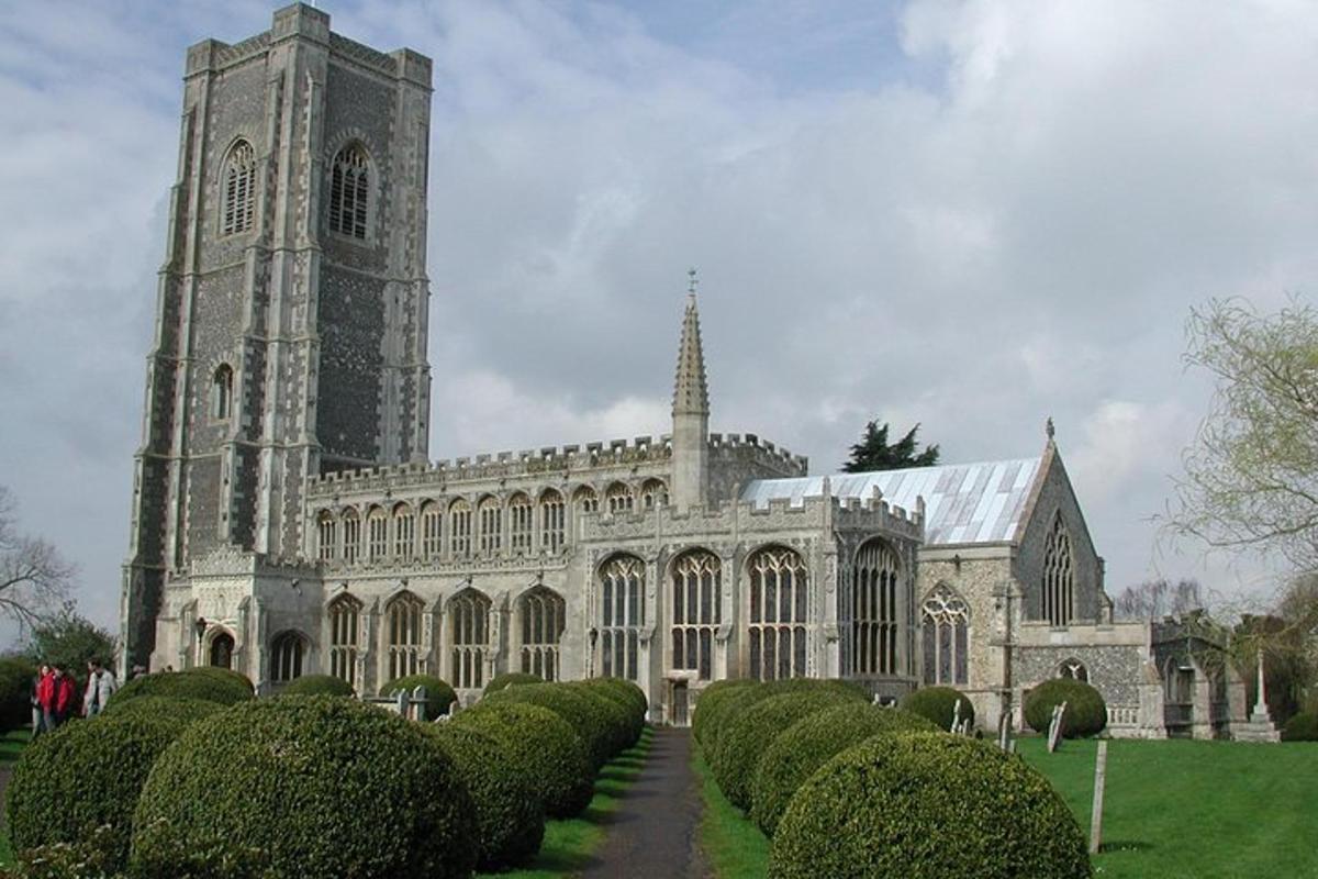a large cathedral with a tower and a large building