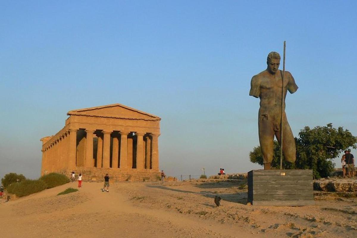 a statue of a man in front of a building