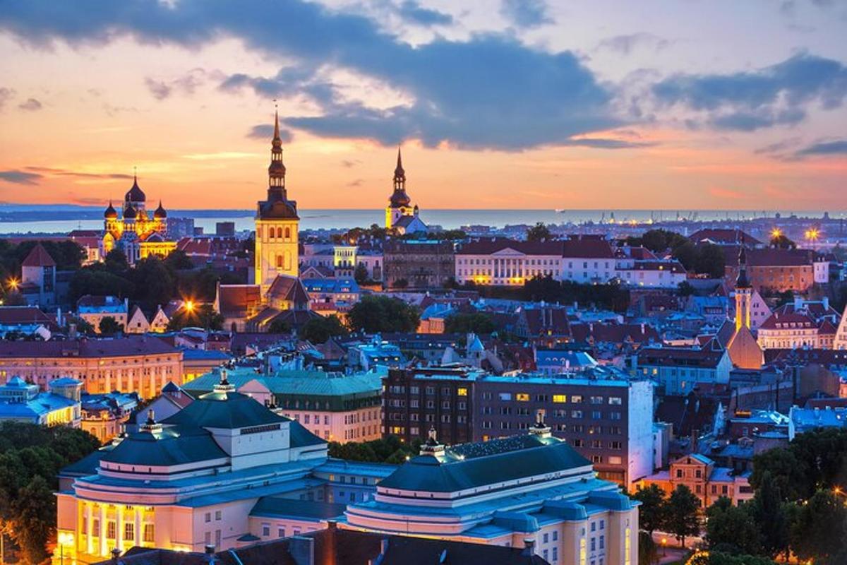 a view of a city at sunset with buildings