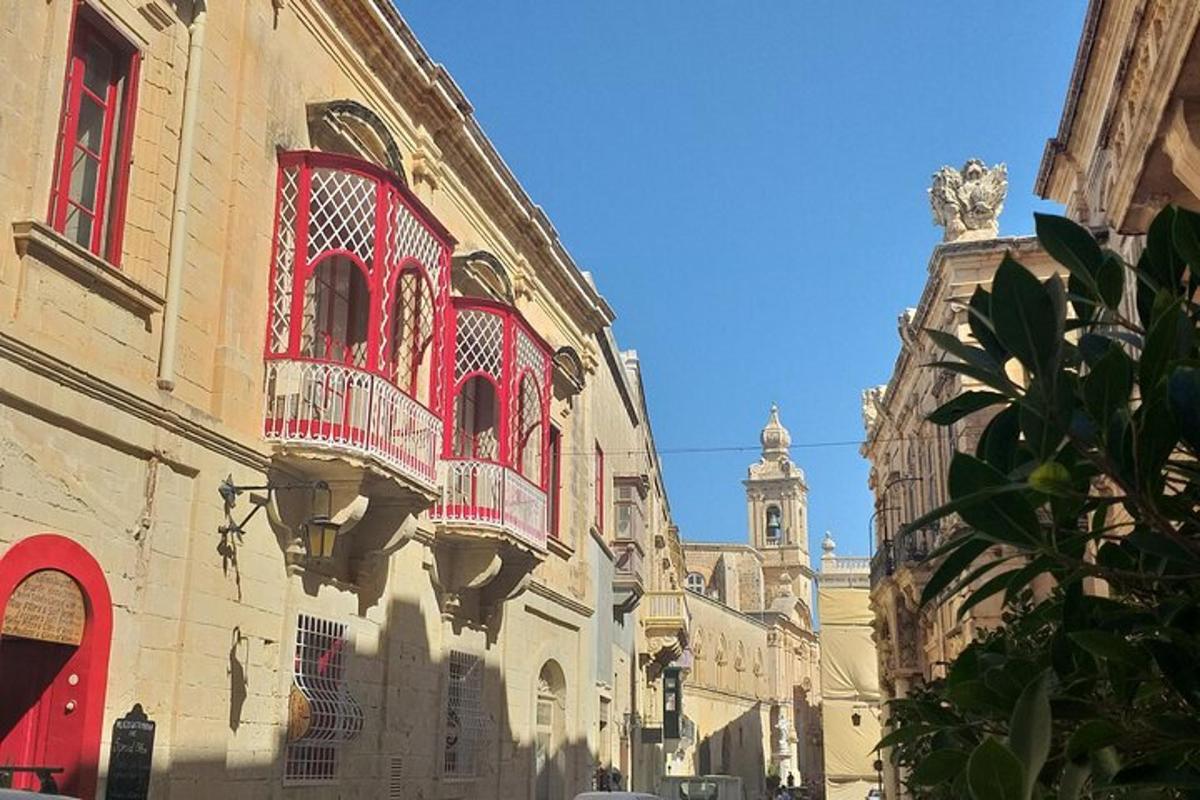 a building with red windows and a building with a cathedral