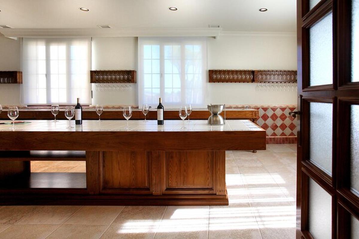 a large room with a large table with wine glasses