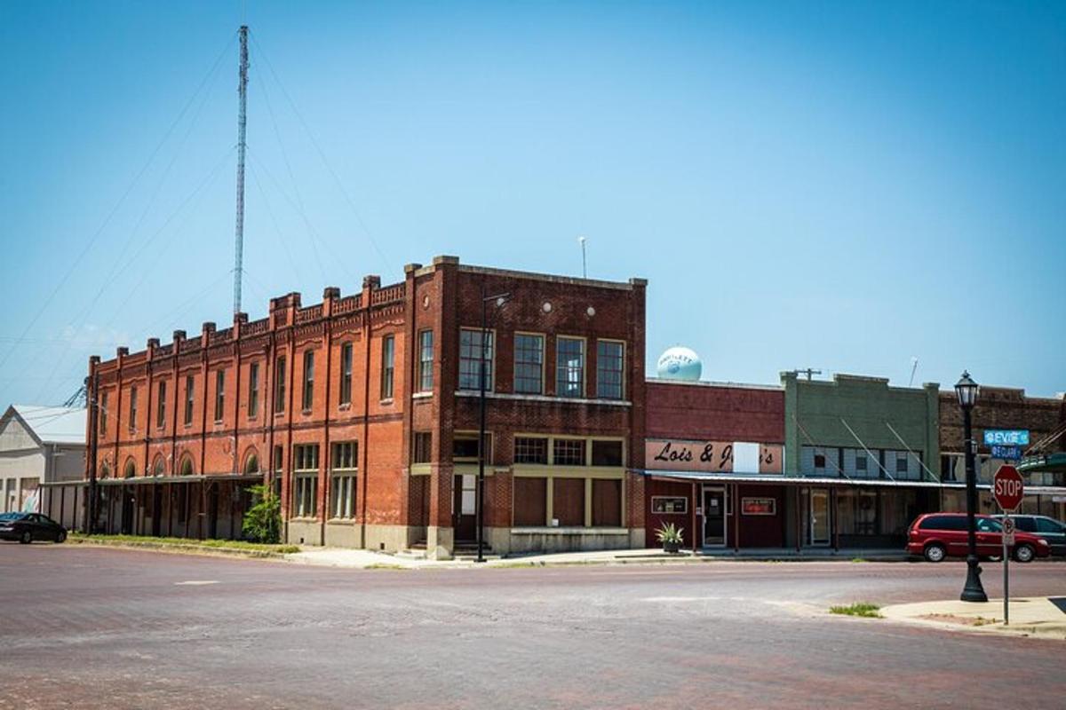 an old brick building on the corner of a street