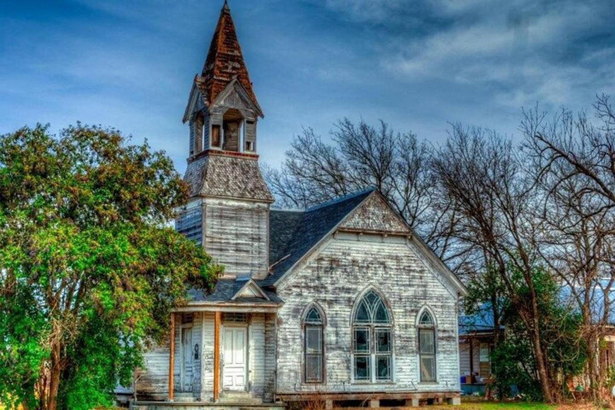 an old church with a steeple on top of it