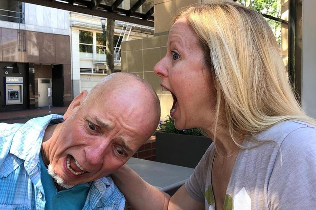 a woman is standing next to a man